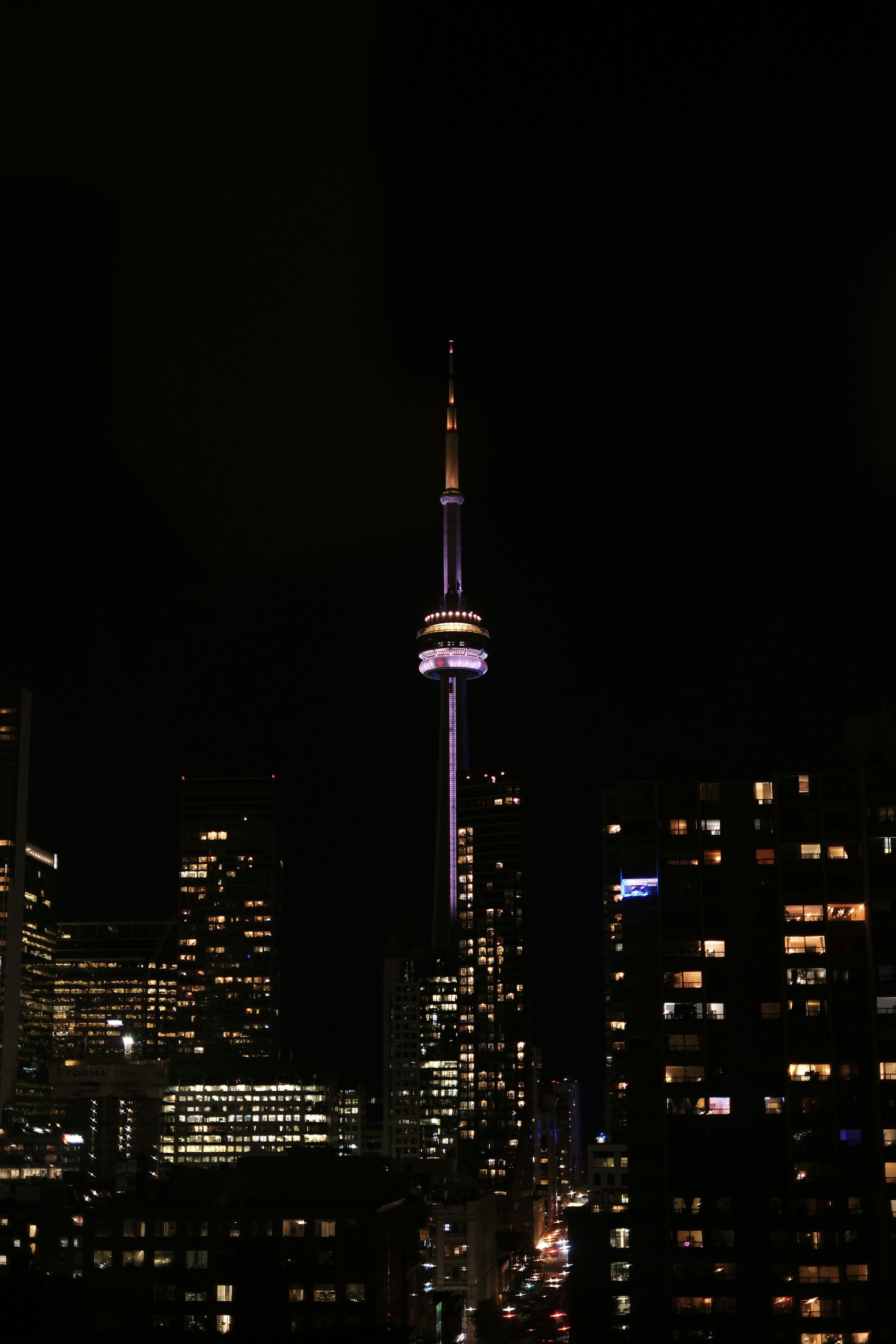 CN Tower illuminated at night — Toronto's defining skyline landmark